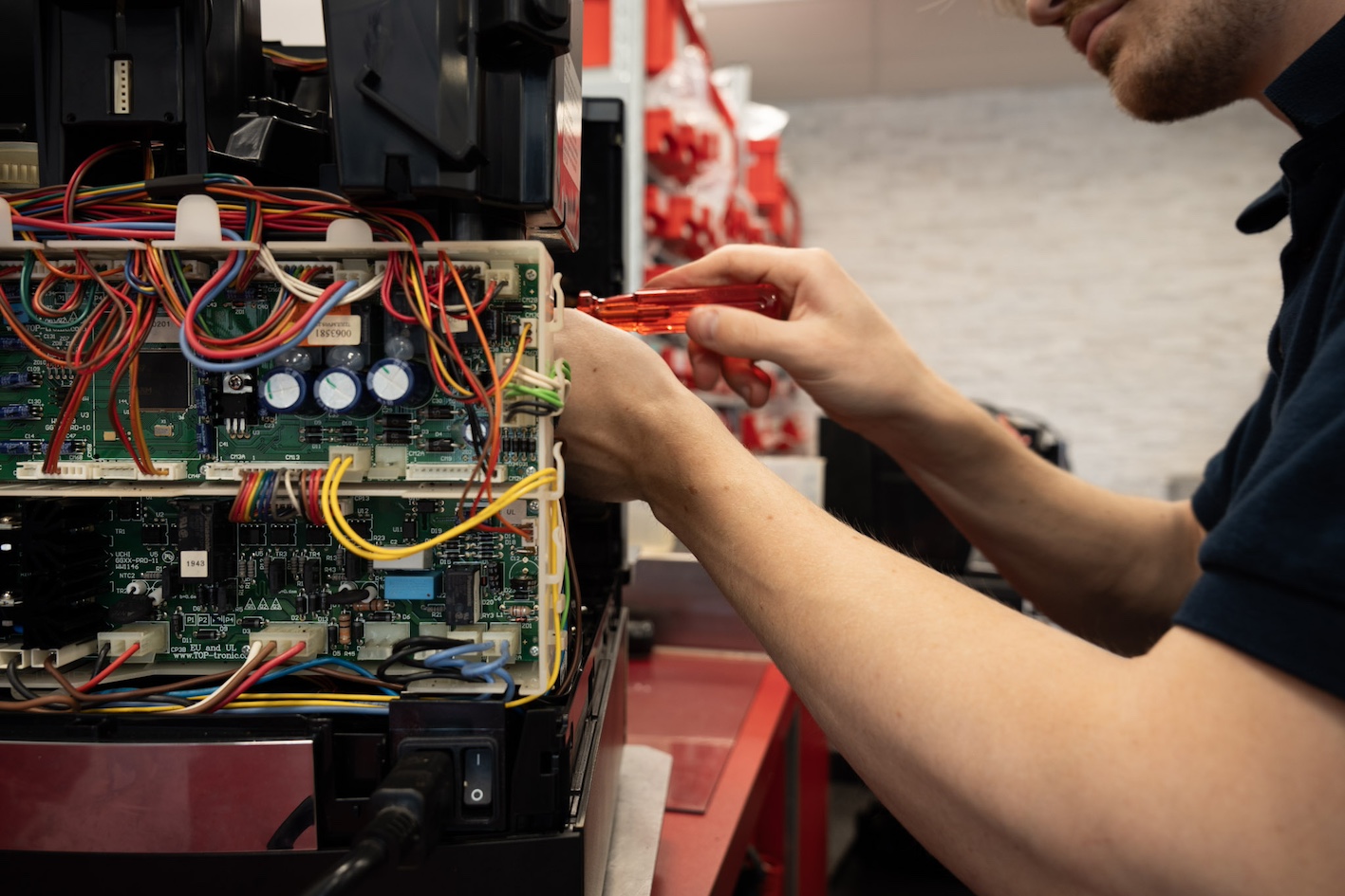 Detailed view of Jura espresso machine interior - service repair in progress