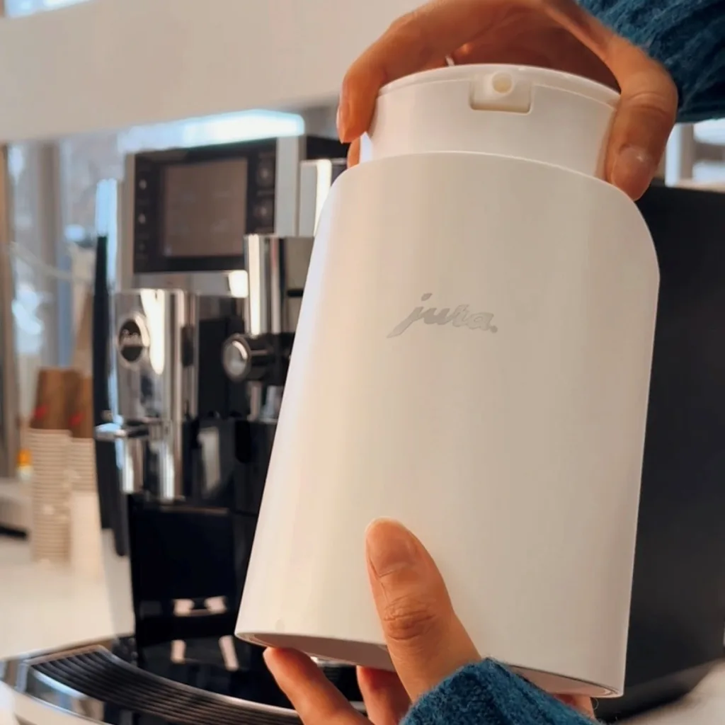 JURA milk carafe inside of a white JURA glacette
